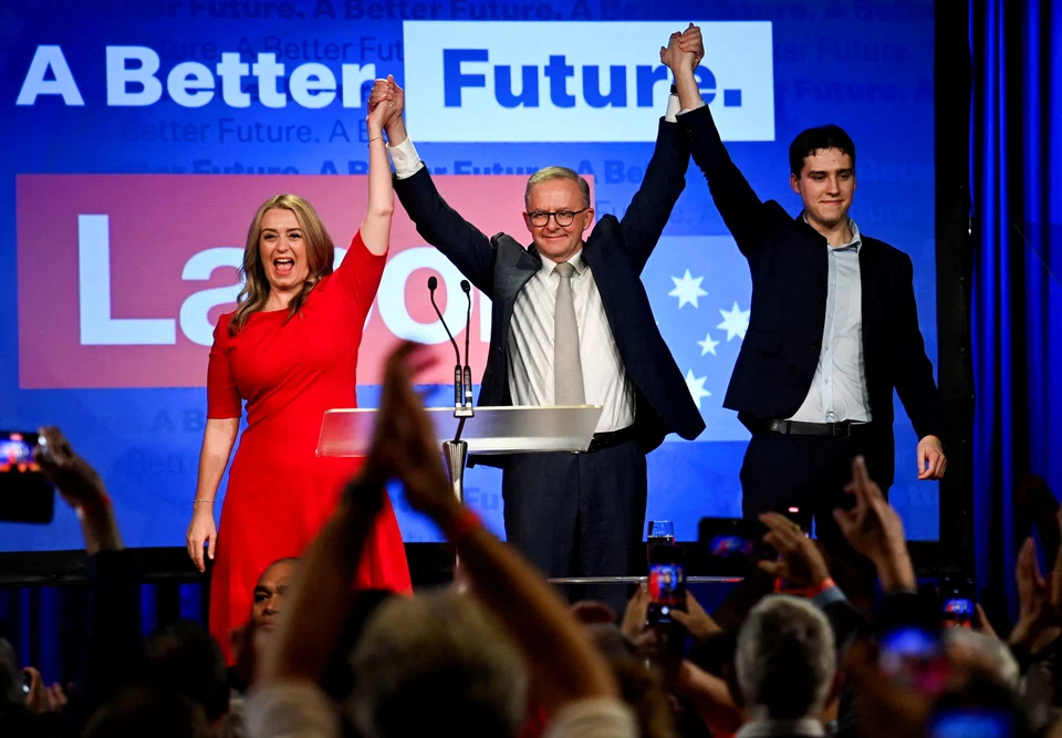 Anthony Albanese, leader of Australia's Labor Party is accompanied by his partner Jodie Haydon and son Nathan Albanese while he addresses his supporters after incumbent Prime Minister and Liberal Party leader Scott Morrison conceded defeat in the country's general election.