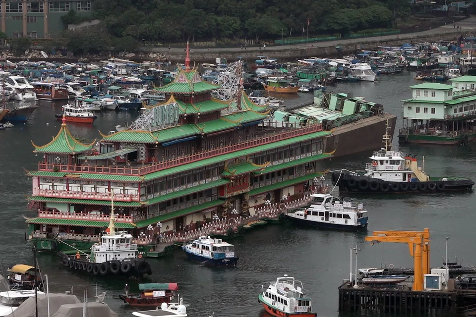 Hong Kong's Jumbo Floating Restaurant, an iconic but aging tourist attraction designed like a Chinese imperial palace, being towed out of Aberdeen Harbour on June 14, 2022, after years of revitalisation efforts went nowhere. 