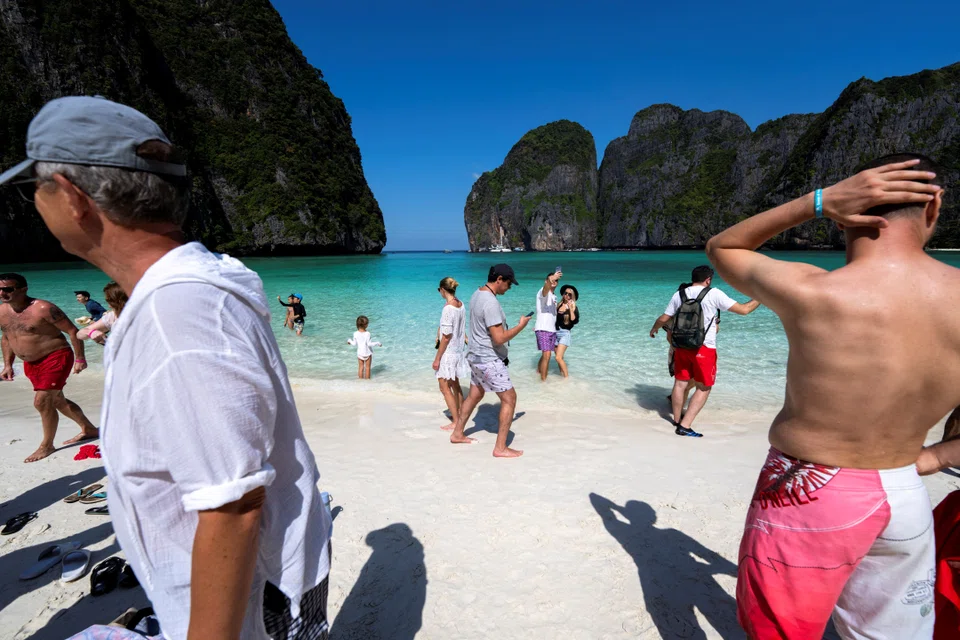Tourists at Maya Bay early this year, after Thailand reopened its world-famous beach after a three-year-long closure wrought by the pandemic. Thai finance minister Arkhom Termpittayapaisith says the nation appeals to travellers looking for bargains, and that the baht’s prolonged weakness will  help bring more foreigners back, 