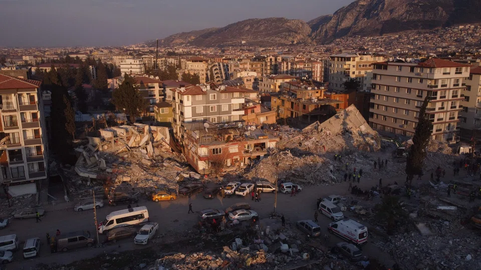Environment Minister Murat Kurum says that 24,921 buildings across the region had collapsed or were heavily damaged in the quake, based on assessments of more than 170,000 buildings.