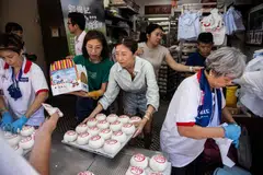 Shops such as the popular Kwok Kam Kee bakery see long queues of festivalgoers eager to sample the Cheung Chau island's favorite sweet buns.