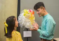 Senior Parliamentary Secretary for Sustainability and the Environment Baey Yam Keng (right) with Naomi Chu, the first-prize winner in the Primary School category of the Art of Trash Competition.
