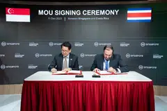 Stanley Loh (left), Permanent Secretary, Ministry for Sustainability and the Environment, and Carlos Isaac Pérez, Vice-Minister of Strategic Affairs, Ministry of Environment and Energy, Costa Rica, signing the MOU on the sidelines of COP28.