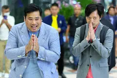 Vacharaesorn (L) and Chakriwat Vivacharawongse, Thailand's King Maha Vajiralongkorn's sons, greet members of the media after a surprise visit recently to the kingdom after living abroad for 27 years. Vacharaesorn wants open discussion of Thailand's royal defamation laws.