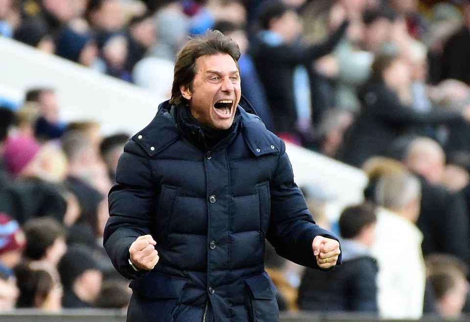 Tottenham Hotspur manager Antonio Conte celebrates after watching a goal scored by his team against Aston Villa in the English Premier League on April 9, 2022.