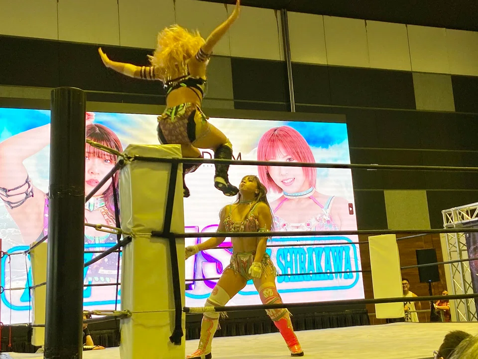 Stardom's Mina Shirakawa (right) battling her opponent AZM at Anime Festival Asia at Suntec Singapore on Nov 25.