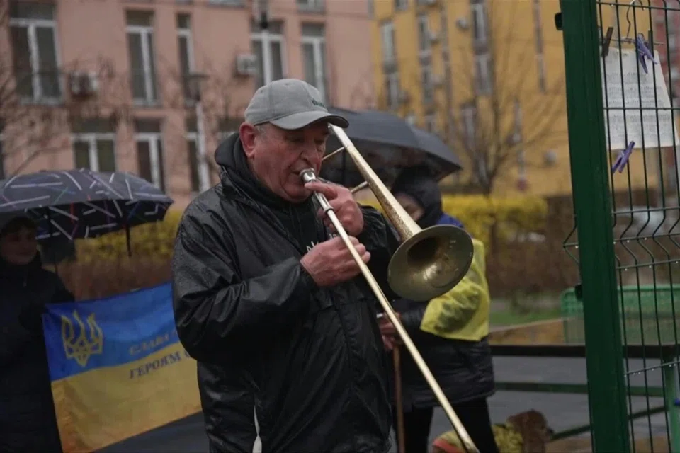 Eighty-year-old retired orchestra director Valentyn Dudkin dusted off his musical instrument after Russian leader Vladimir Putin sent troops into Ukraine a year ago.
