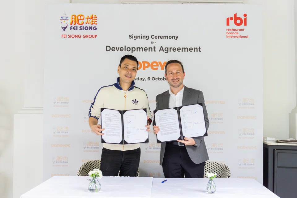 From left: Tan Kim Siong, chairman of Fei Siong Group, and Rafael Odorizzi, APAC president of Restaurant Brands International, at the partnership signing ceremony.