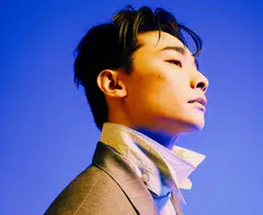 Glenn Goh in a printed shirt, mohair sweater, blazer, necklace, all Dior. 