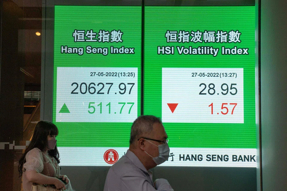 Asian markets fell again on Monday and oil prices extended losses on growing fears that central bank moves to rein in soaring inflation will induce a recession.