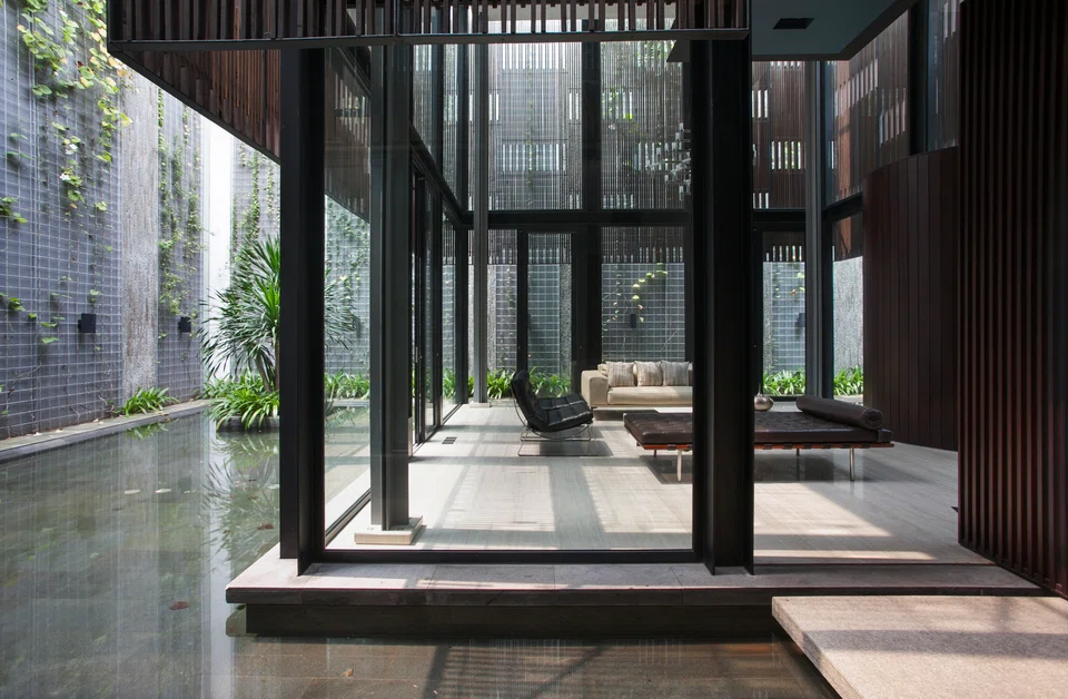 The main highlight of the home is a tower surrounded by water.