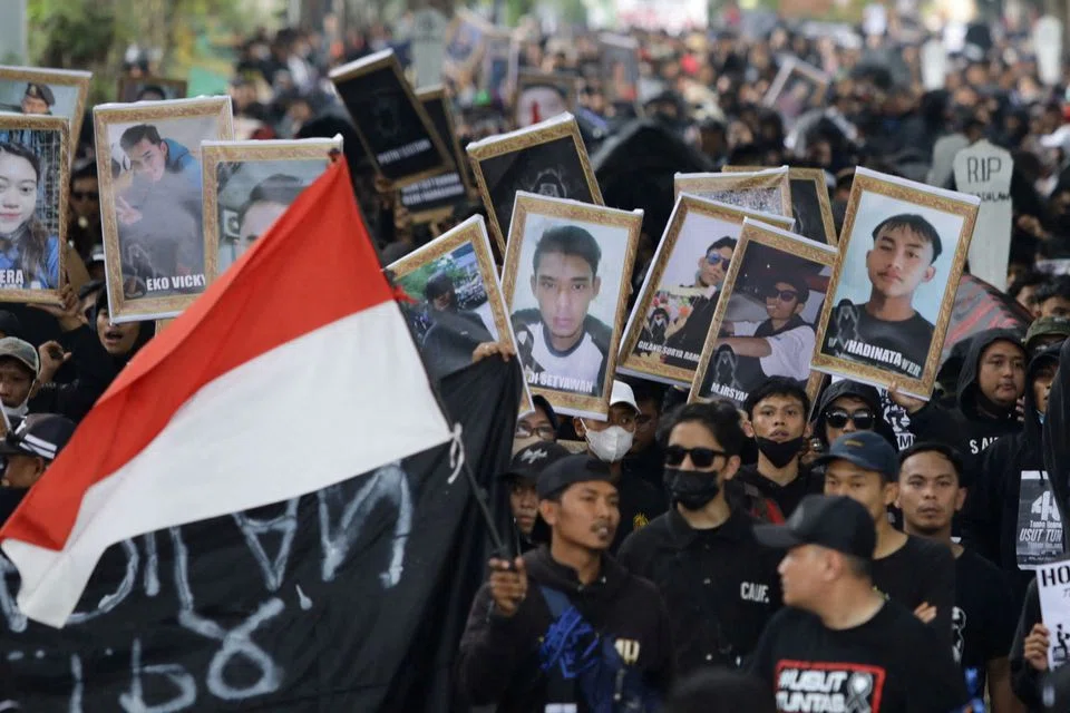 Protesters, some carrying coffins and signs that said “All this because of tear gas” as they marched on the main thoroughfare of the city of Malang, also called for the tragedy to be deemed a gross human rights violation.
