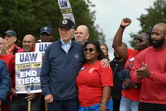 US President Joe Biden joins a picket line with members of the United Auto Workers union at a GM Service Parts Operations plant in Belleville, Michigan, Sept 26, 2023.