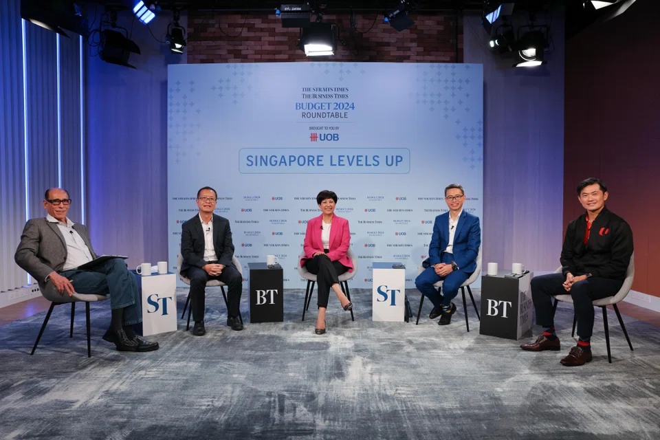 The ST-BT Budget Roundtable 2024 was moderated by ST associate editor Vikram Khanna (left), with panellists (left to right) UOB senior economist Alvin Liew; Second Minister for Finance Indranee Rajah; Association of Small and Medium Enterprises president Ang Yuit; and NTUC deputy secretary-general Desmond Tan.