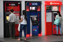 DBS, UOB and OCBC each report a 10 per cent drop in net profit; Cuscaden offers S$0.9372 per SPH Reit unit, 3.9% below last traded price; and more.