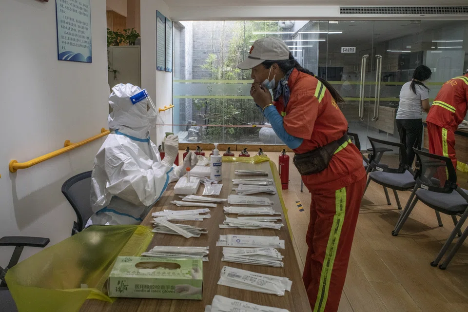 Authorities in China’s capital warned on Tuesday that a Covid-19 surge in cases linked to a 24-hour bar was critical and the city of 22 million was in a “race against time” to get to grips with its most serious outbreak since the pandemic began.