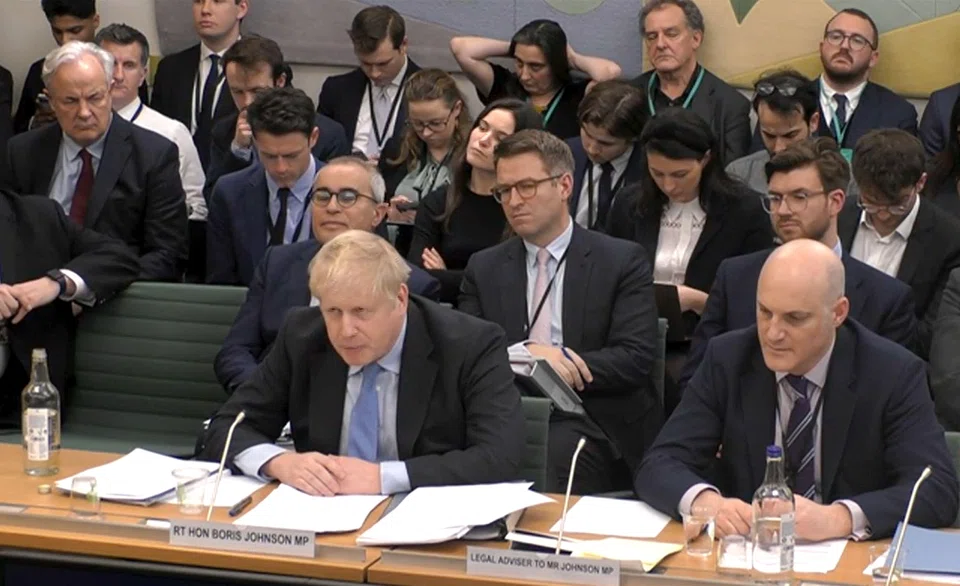 Former British Prime Minister Boris Johnson making his opening statement as he attends a Parliamentary Privileges Committee hearing, in central London on March 22, 2023. He said he was not warned the events broke the rules and has accused the committee of bias.