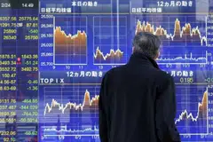 Asian stocks were mixed Monday as inflation fears and concerns about low economic growth weighed on markets. 