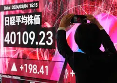 Tokyo and Hong Kong dipped at Tuesday's open, a day after Japan’s benchmark Nikkei index hit a record high, closing above 40,000 points for the first time.