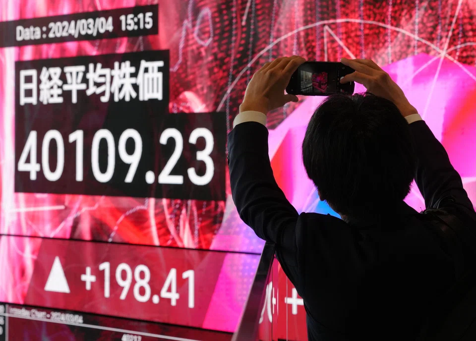 Tokyo and Hong Kong dipped at Tuesday's open, a day after Japan’s benchmark Nikkei index hit a record high, closing above 40,000 points for the first time.