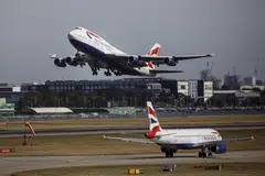 A plane takes off from the runway at Heathrow Airport's Terminal 5. The airport will review proposals to boost runway efficiency.