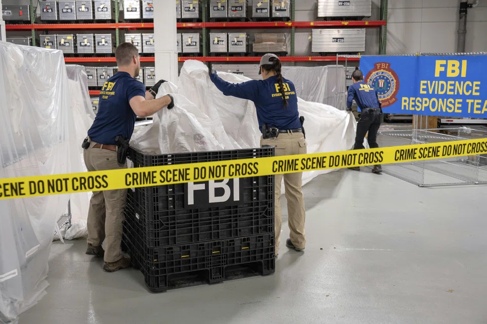 FBI special agents processing remnants from a suspected Chinese balloon at a laboratory in Quantico, Va., on  Feb 9, 2023.  US warplanes shot down another flying object on Sunday, this time over Lake Huron on the US-Canadian border.