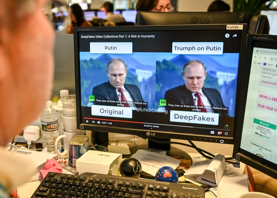 A AFP journalist watches a video manipulated with artificial intelligence to potentially deceive viewers, or "deepfake" at his desk in Washington, DC, Jan 25, 2019.