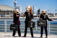 Environmental activists from Ocean Rebellion wearing fish heads and pinstripe suits call on UN delegates and world leaders to use their power and influence to end the war on fish and govern for life in the ocean. The UN Ocean Conference opened in Lisbon, Portugal, on Monday (Jun 27).