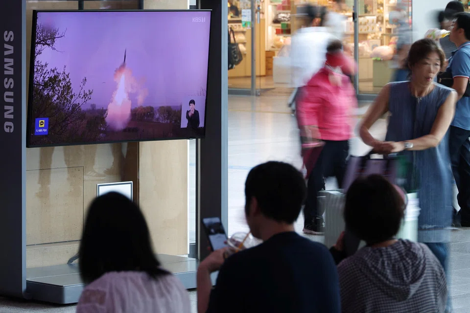 TV broadcasting North Korea's firing of a ballistic missile off its east coast at a railway station in Seoul. The suspected ICBM flew for 74 minutes to an altitude of 6,000 km and range of 1,000 km.