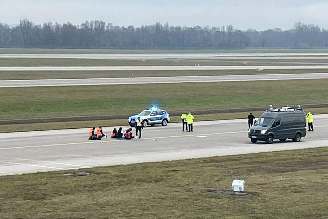 The protest marks the second time climate activists have penetrated security fences at Berlin airport in as many weeks.