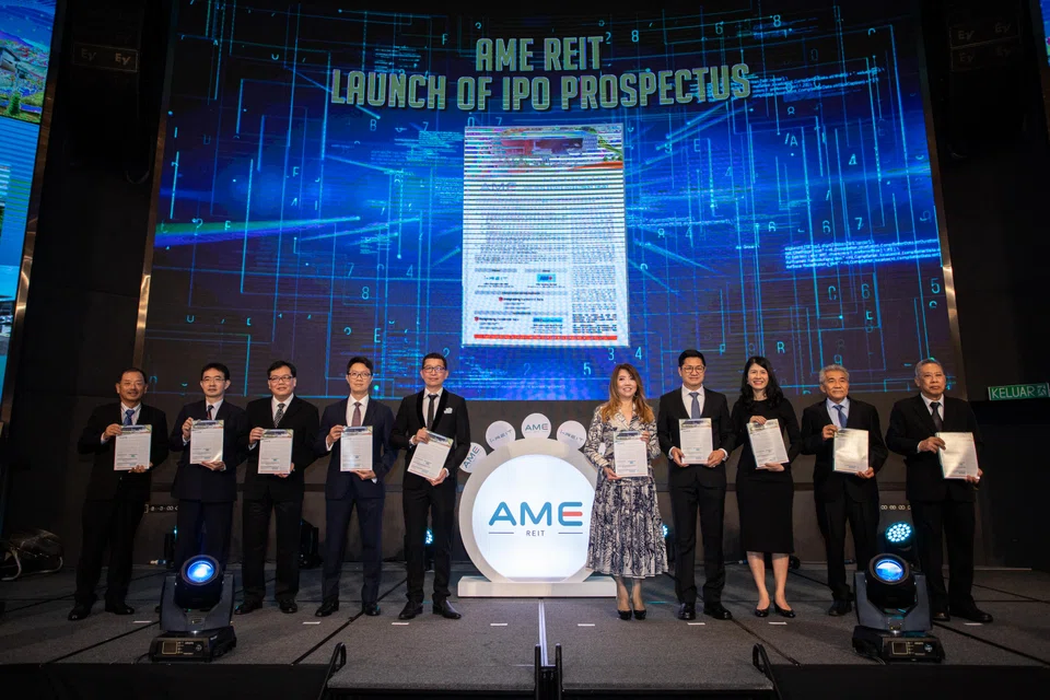 I Reit Managers chief executive officer and executive director Chan Wai Leo (fourth from left) and I Reit Managers chairman and executive director Simon Lee, with other stakeholders at AME Reit’s initial public offering prospectus launch on Aug 17, 2022.