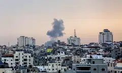Smoke rises over Gaza City after an Israeli airstrike on Oct 9, 2023. Since Hamas launched a deadly cross-border attack into Israel over the weekend, violent videos and graphic images have flooded social media; many of the posts have been seeded by Hamas to inspire terror and take advantage of the lack of content moderation on some social media sites. 