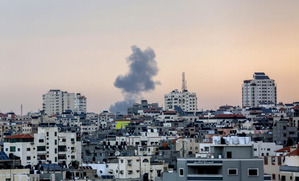 Smoke rises over Gaza City after an Israeli airstrike on Oct 9, 2023. Since Hamas launched a deadly cross-border attack into Israel over the weekend, violent videos and graphic images have flooded social media; many of the posts have been seeded by Hamas to inspire terror and take advantage of the lack of content moderation on some social media sites. 
