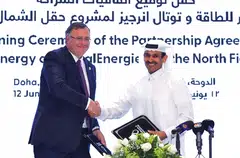 Kaabi (right) and Pouyanne at a signing ceremony at the Qatar Energy headquarters; Qatar Energy has started drilling development wells for the North Field East project. It chose Chiyoda of Japan and London-based TechnipFMC to do the main construction work.
