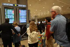 Passengers at a departure board at Ben Gurion Airport; American Airlines, Air France, Lufthansa, Emirates and Ryanair are among those pulling flights to Tel Aviv’s Ben Gurion airport.