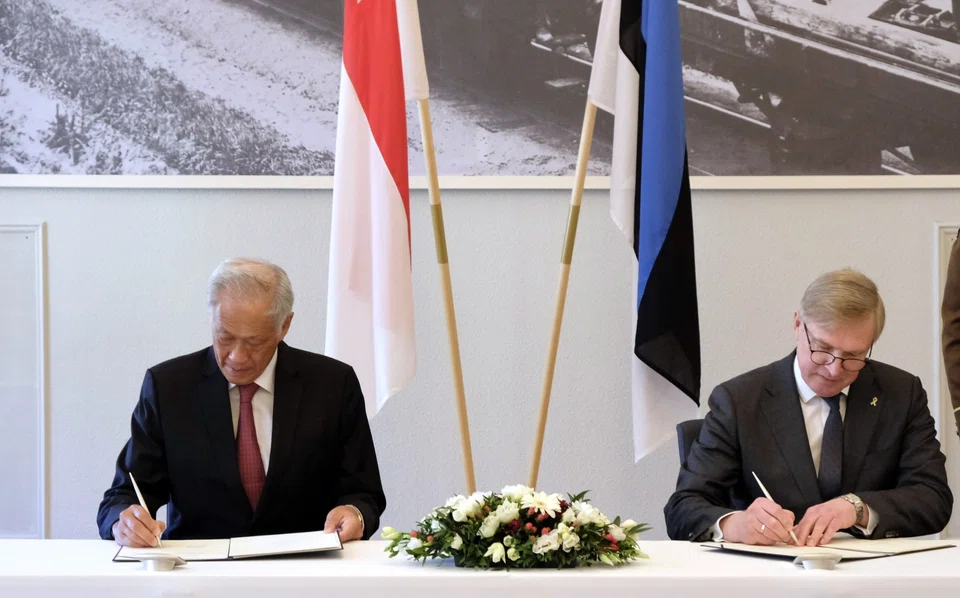Singapore Minister for Defence Ng Eng Hen and his Estonian counterpart, Kalle Laanet, signing a memorandum on bilateral defence cooperation.