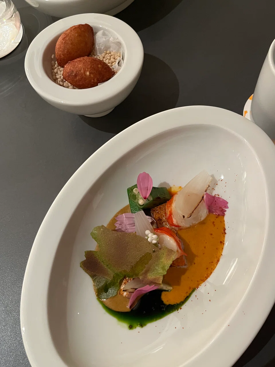 Acaraje & Vatapa features thick spicy gravy and mixed seafood.