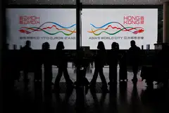 Travellers at Hong Kong International Airport. The US, Japan and some other countries are requiring travellers from China to show a negative test before allowing them to enter.