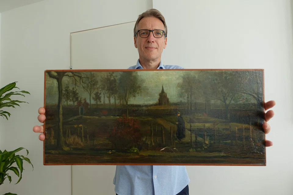 Dutch art detective Arthur Brand poses with the recovered "Parsonage Garden at Nuenen in Spring", painted by Vincent van Gogh in 1884.