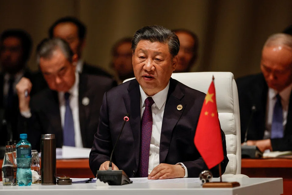 FILE PHOTO: President of China Xi Jinping attends the plenary session during the 2023 BRICS Summit at the Sandton Convention Centre in Johannesburg, South Africa on August 23, 2023. GIANLUIGI GUERCIA/Pool via REUTERS/File Photo