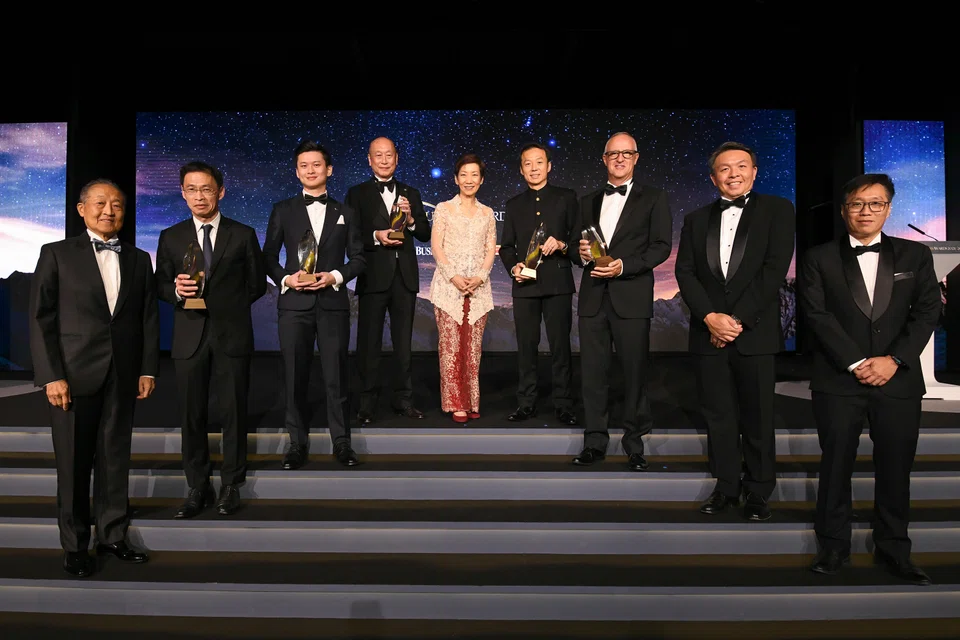 Honouring excellence: (from left) Stephen Lee, chairman of the SBA judging panel; Tan Hak Leh, regional chief executive, AIA Group,  representing Lee Yuan Siong, chief executive officer of AIA Group (Outstanding Overseas Executive of the Year); Ian Ang, co-founder and CEO, Secretlab SG (Young Business Leader of the Year); Wee Ee Cheong, deputy chairman & CEO, UOB (Businessman of the Year); guest­-of-­honour Minister for Sustainability and the Environment, Grace Fu; Lee Chee Koon, president & group CEO, CapitaLand Investment (Outstanding Chief Executive of the Year); Laurent Junique, founder and CEO of TDCX (The Enterprise Award); Christopher Ong, senior vice­-president & managing director, DHL Express Singapore; Wong Wei Kong, editor, The Business Times.