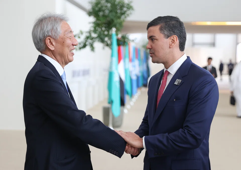 Singapore's Senior Minister and Coordinating Minister for National Security Teo Chee Hean and Paraguay president Santiago Pena meeting on the sidelines of the 28th UN Climate Conference in Dubai on Dec 2. 