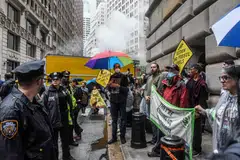 A climate protest in the Financial District of Manhattan, on Sept. 18, 2023. Several major firms have retreated from a global climate coalition, Climate Action 100+.
