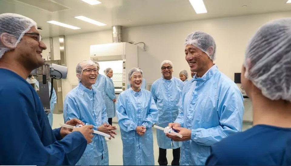Minister of Health Ong Ye Kung (right) during his tour of Hilleman Laboratories $27 million plant in Depot Road. 