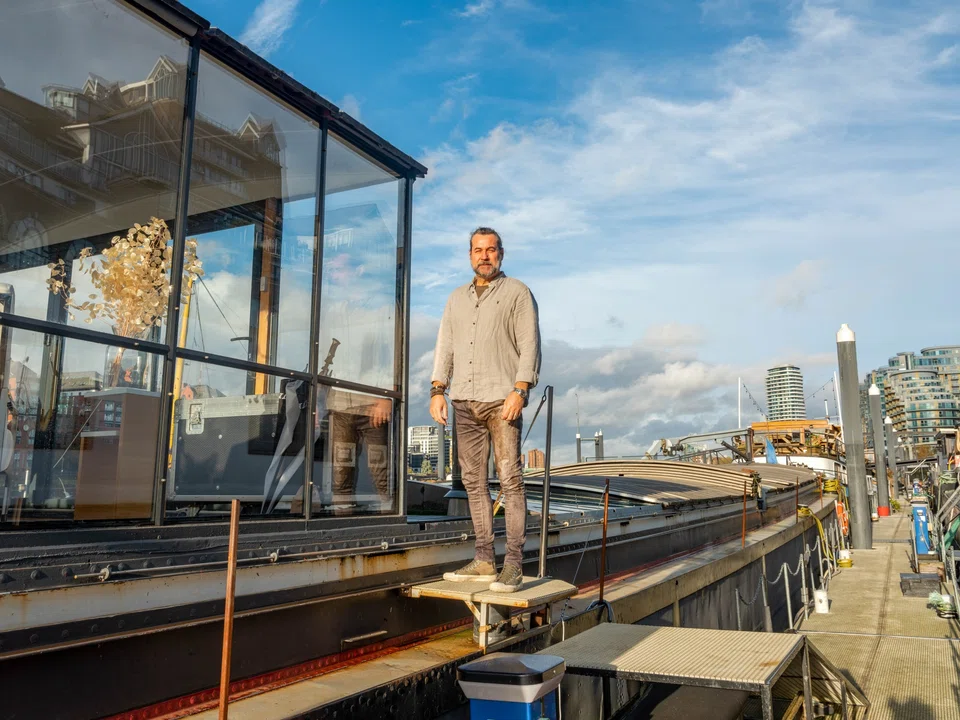 Michael Fox rents a 130-foot Dutch barge with two bedrooms, a bathroom, a galley and a lounge with a retractable glass roof. 