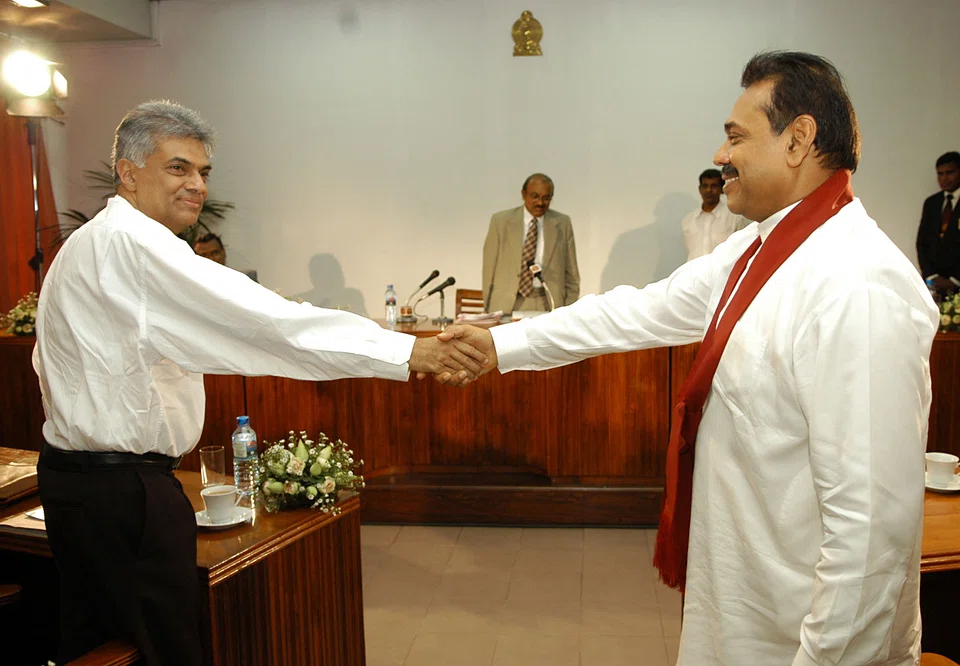 Ranil Wickremesinghe (left) returns to office to replace Mahinda Rajapaksa (right), who resigned on Monday. 