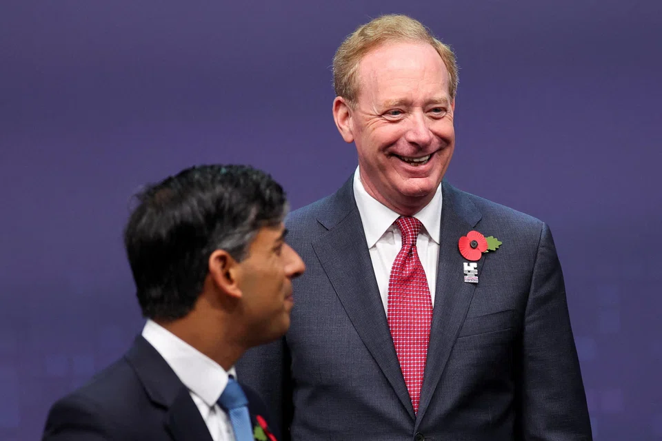 “There’s absolutely no probability that you’re going to see this so-called AGI, where computers are more powerful than people, in the next 12 months," says Microsoft's president Brad Smith(L).