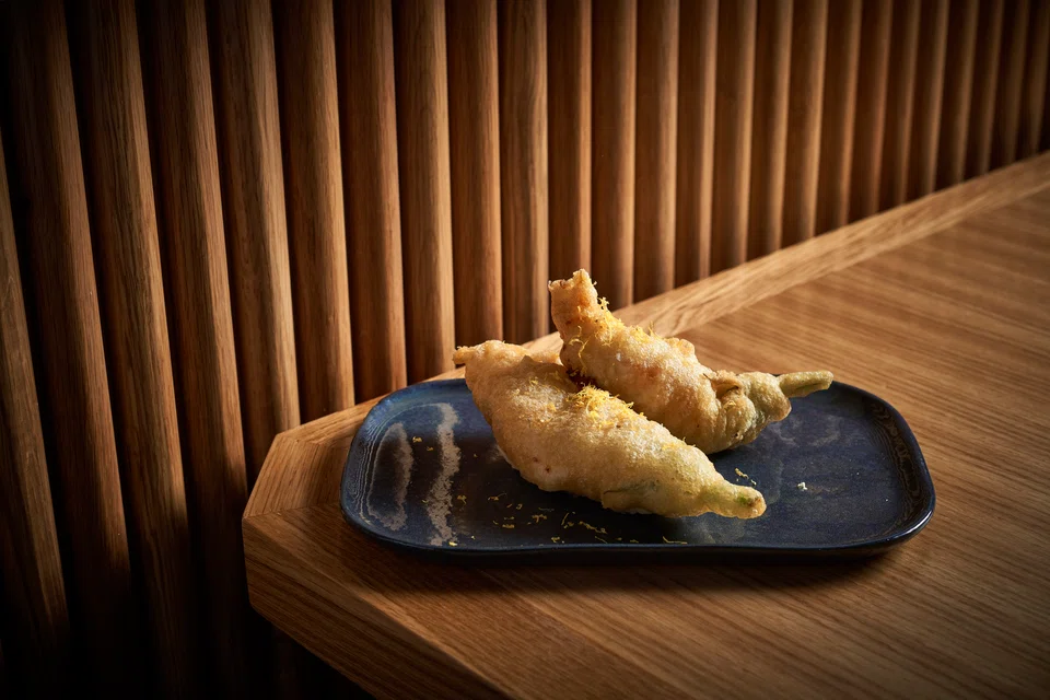 Deep-fried  zucchini flower fritters.