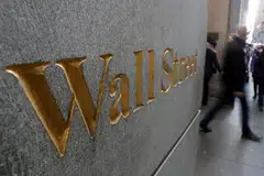 Wall Street stocks finished a choppy session higher as investors took an optimistic view of Federal Reserve minutes.