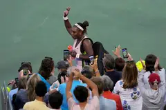 Serena Williams waved to the crowd after losing, 6-4, 6-0, to Emma Raducanu of Britain on Tuesday. 